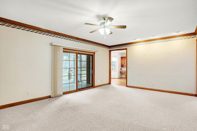 Great Rm looking towards kitchen and sliding glass doors to covered screened in patio. | Image 19