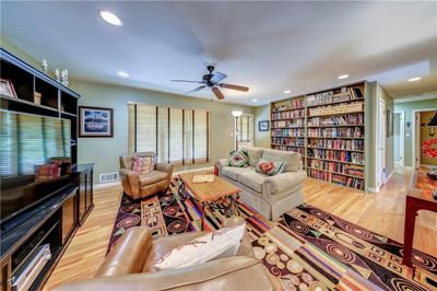 Living room with ceiling fan and hardwood / wood-style floors | Image 3