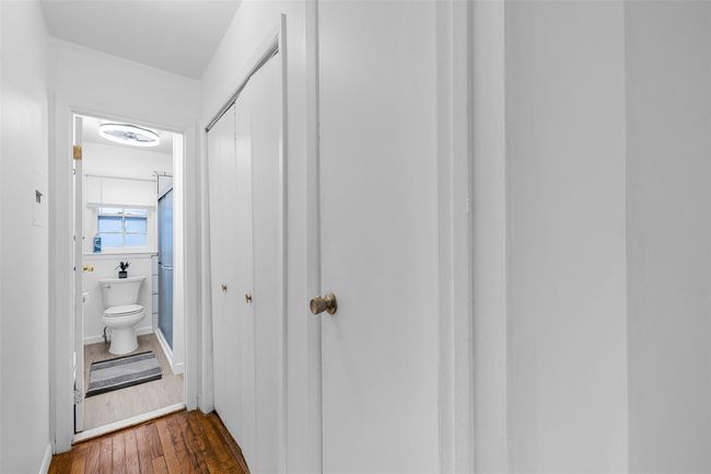 Hallway featuring dark wood-type flooring | Image 11