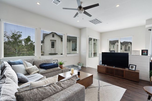 Living area with a ceiling fan, dark wood finished floors, and recessed lighting | Image 19