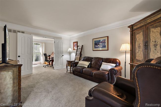 Extra sitting room on main level leading to office | Image 24
