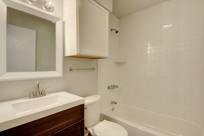 Full bath featuring toilet, vanity, and shower / bathtub combination | Image 19