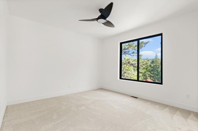 Bedroom on second-level with large window | Image 36
