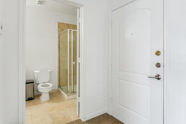 Full bath featuring toilet and a stall shower | Image 27