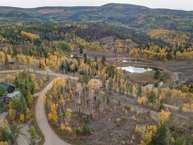 Bird's eye view featuring a water and mountain view and a view of trees | Image 7