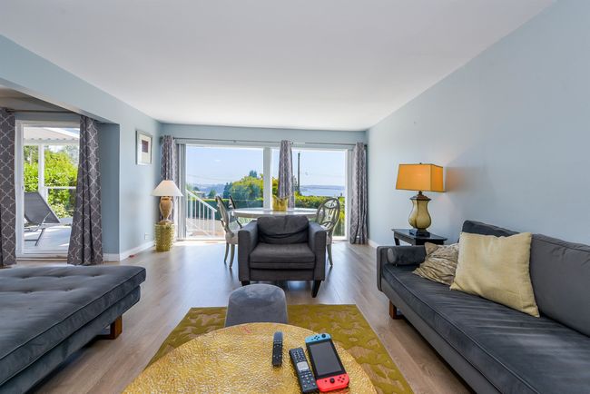 Living room featuring baseboards and wood finished floors | Image 8