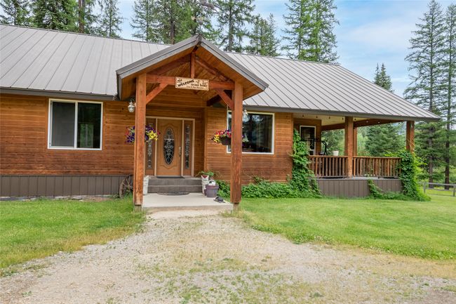 View of front of house with a front yard and a metal roof | Image 4
