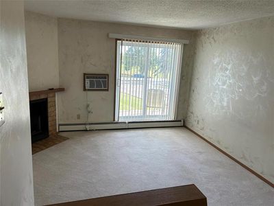 Spacious living room with access to balcony. | Image 2