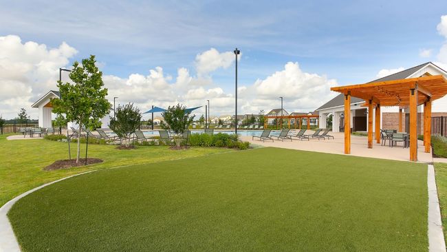 View of yard with a patio area, a community pool, and a pergola | Image 14