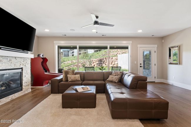 Lower level family room with access to lower covered patio | Image 16