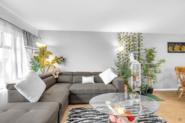 Living area featuring baseboards and wood finished floors | Image 15