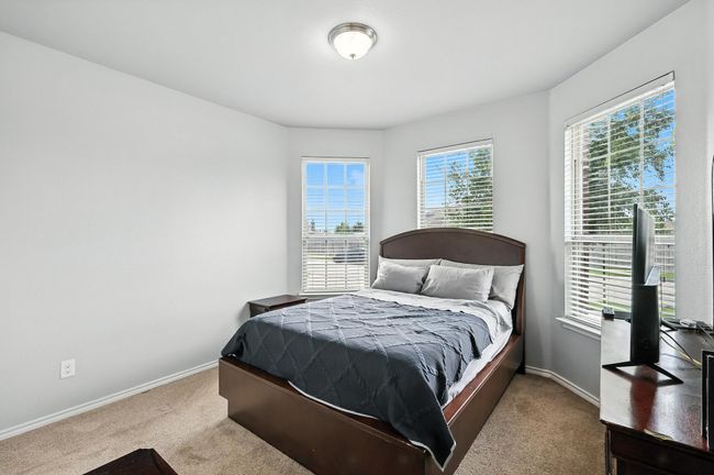 Carpeted bedroom with baseboards | Image 14