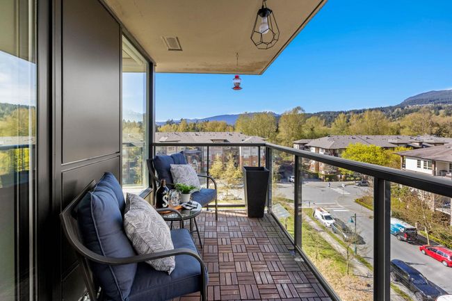 Balcony featuring a mountain view and visible vents | Image 23