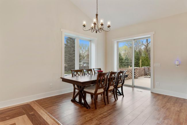 The dining room walks out to one of the two concrete patios | Image 16