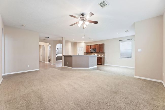 Enjoy some family time in the back room next to the kitchen and breakfast area | Image 11
