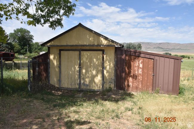 View of shed featuring a mountain view | Image 25