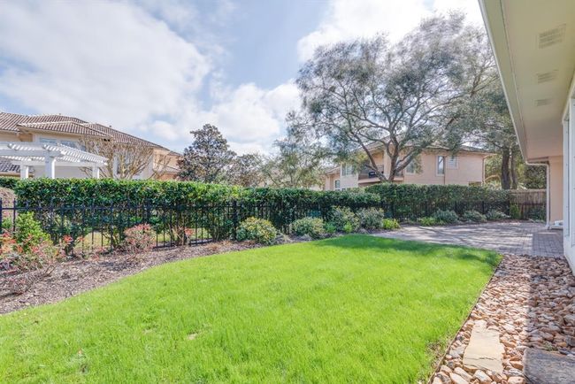 Rear yard with green space. French drains have been installed. | Image 44