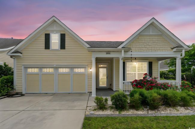 View of front of property with a porch, driveway, and roof with shingles | Image 34