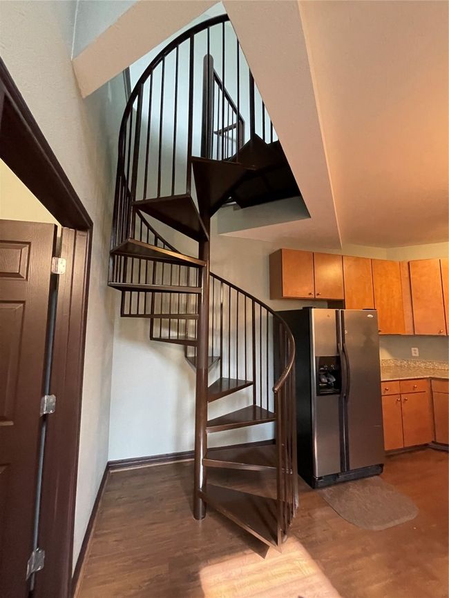 Stairway featuring wood finished floors and baseboards | Image 9