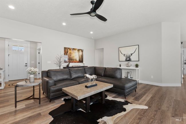 Living room featuring a ceiling fan, wood finished floors, and recessed lighting | Image 12
