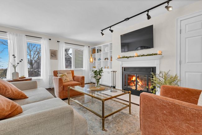 Living Room overlooking the Marsh with Wood Burning Fireplace | Image 5