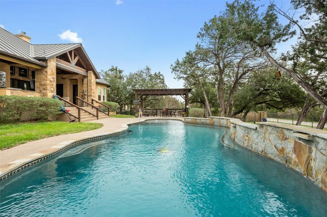 When you get tired take a seat along the edge of the pool with the ample surround seating. | Image 36