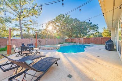 This stunning 5-bedroom home features a sparkling pool and spa perfect for entertaining! | Image 1