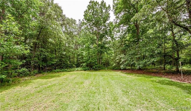 View of green lawn featuring a forest view | Image 36