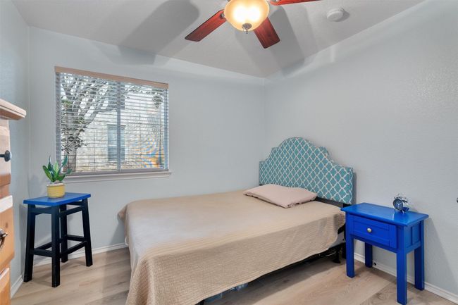 Secondary bedroom with light/ceiling fan combination | Image 21