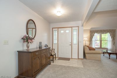 Carpeted foyer entrance | Image 2