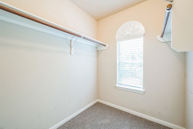 Walk in closet featuring carpet floors | Image 25