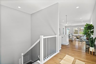 Hall with light hardwood / wood-style flooring | Image 2