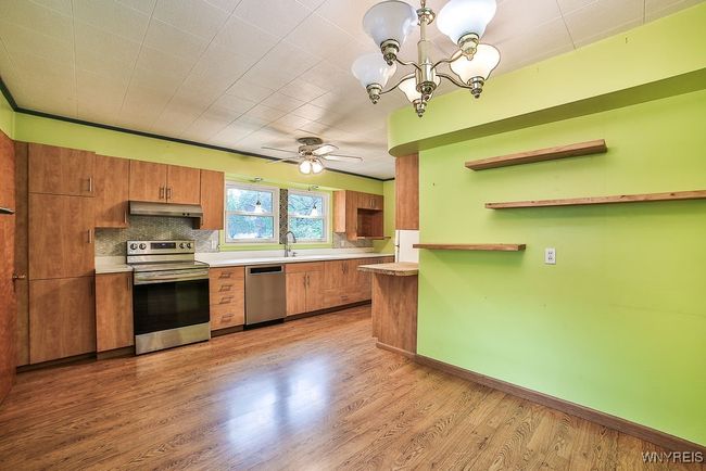 Dining area into kitchen view | Image 12
