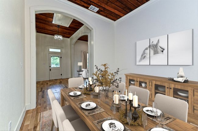 Dining room featuring wood ceiling, arched walkways, ornamental molding, and wood finished floors | Image 13