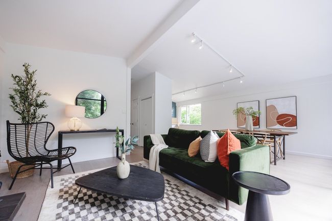 Living room featuring track lighting and wood finished floors | Image 12