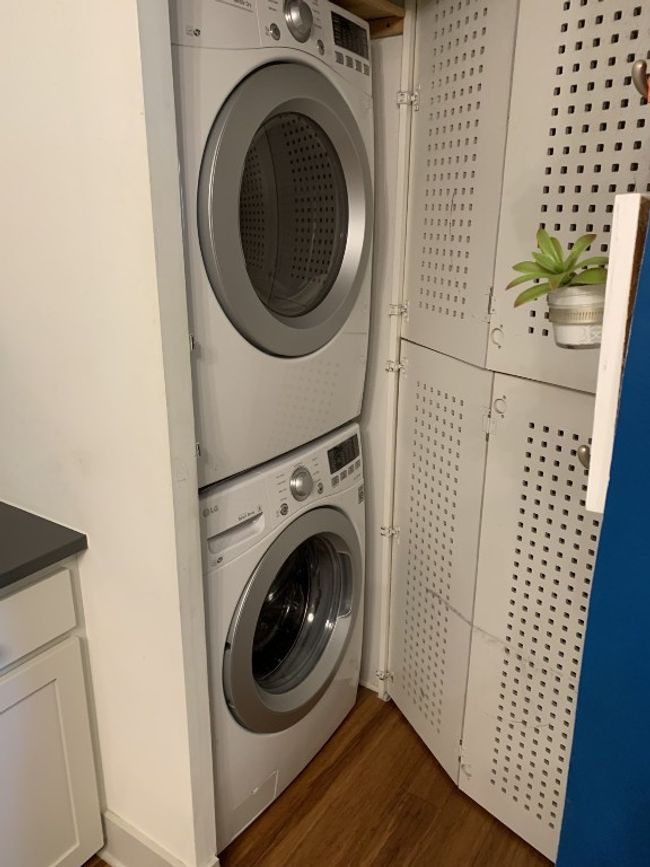 Washroom featuring stacked washing machine and dryer. | Image 9