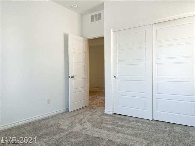 Upstairs bedroom featuring carpet and window blinds | Image 16