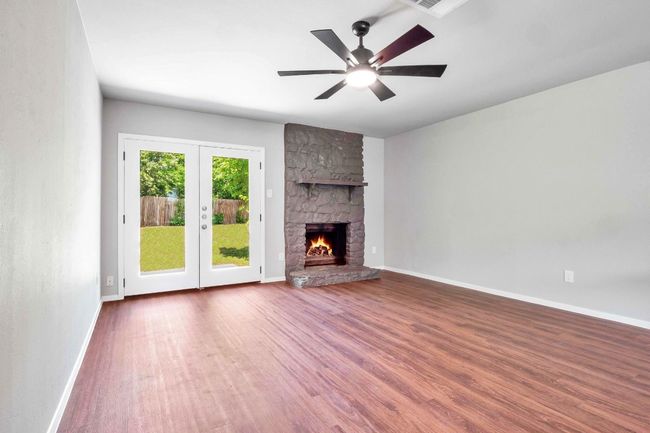 Unfurnished living room with french doors | Image 7