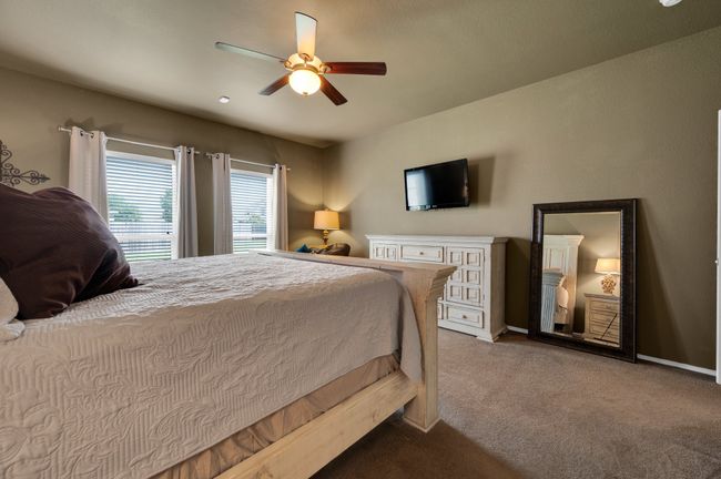 Bedroom featuring carpet and a ceiling fan | Image 19