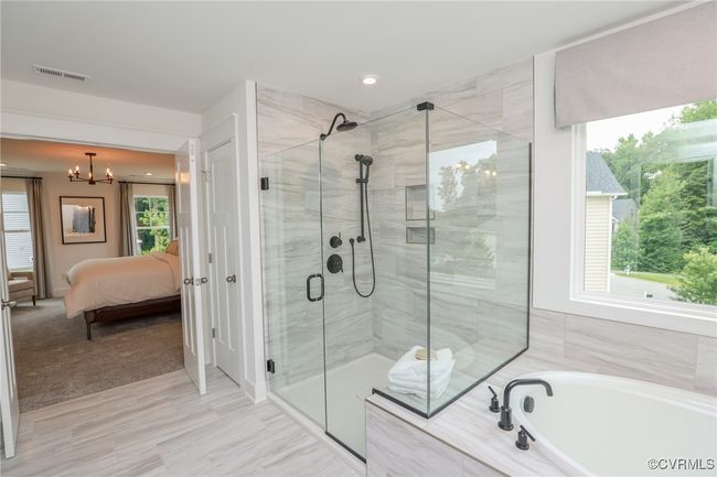 VIRTUAL STAGING. Photo represents the plan with virtual staging. Luxurious primary suite. | Image 24