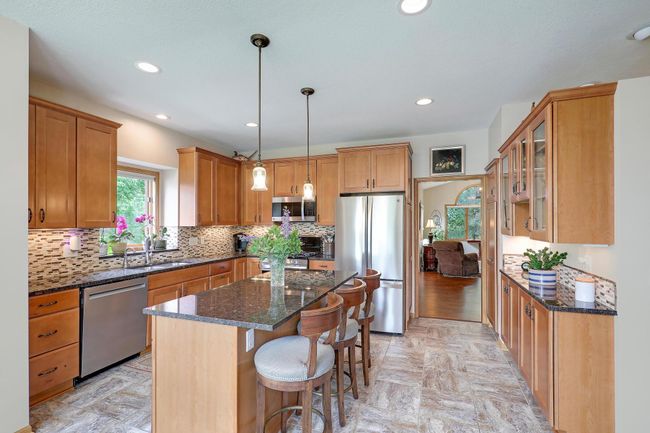 Note the stainless steel appliances and beautiful tile flooring. | Image 17