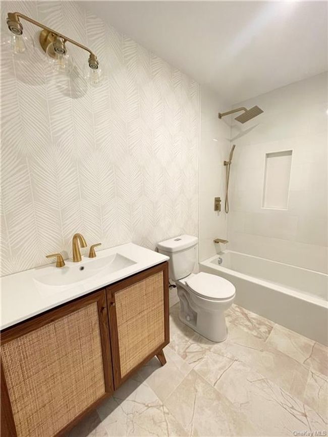 Example of the work we do. Not this house. Full bathroom with tile patterned flooring, shower / bathing tub combination, toilet, and vanity | Image 13