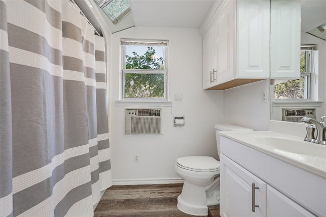 Directly around the corner from the Dining Room, this Full Bath lets the sunshine in and is perfectly located for family and guests. | Image 16