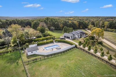 Aerial of the home, gardens, pool house and pool | Image 2