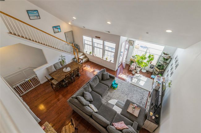 Living room with recessed lighting, stairway, and wood finished floors | Image 14