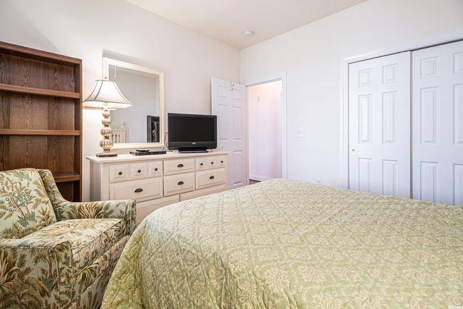 Bedroom featuring a closet | Image 23
