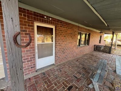 Front Door Located Under Covered Patio | Image 2