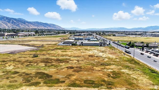 Aerial perspective of suburban area featuring a mountain backdrop | Image 13