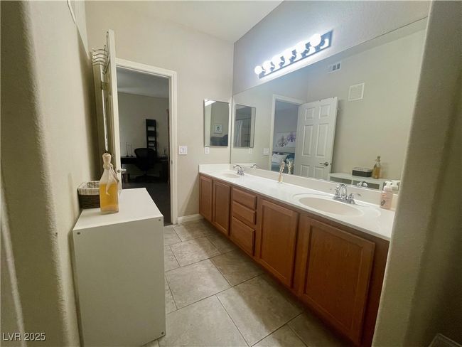 Full bathroom featuring a sink, ensuite bathroom, double vanity, and visible vents | Image 36