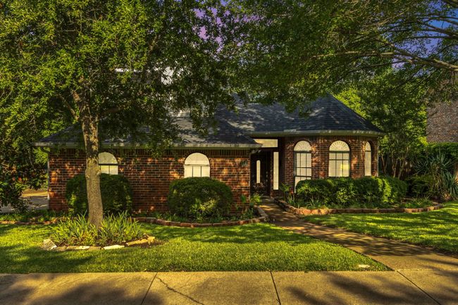 View of front of home featuring brick siding and a front yard | Image 4